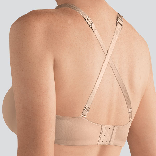 Back of the Amoena Barbara strapless underwire bra showing the clip-on material straps worn in a cross-over configuration.