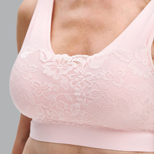 Close-up of the Nicola Jane Amber bamboo mastectomy crop top showing the lace pattern and higher camisette neckline.