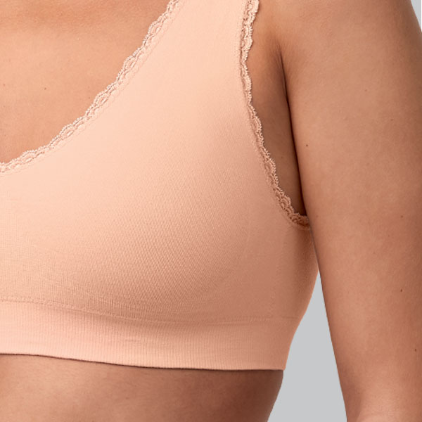 Close-up of the Amoena Kitty soft wireless pullover bra showing the wider band and medium height upward curving underarm.