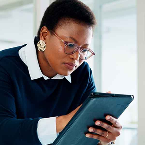Lady using Zoom to have a Virtual Fitting conversation with the Fitter to select a massage pad to target breast lymphoedema.