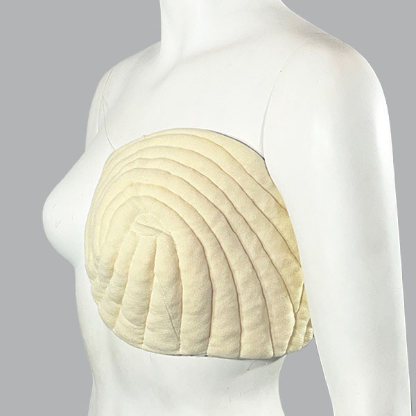 Mannequin viewed from the front showing the Jobst JoViPad Post Lumpectomy Pad is positioned over the breast and underarm.